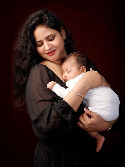 There is nothing as peaceful as a mother holding her sleeping newborn. I focus on capturing that serene and powerful connection.
