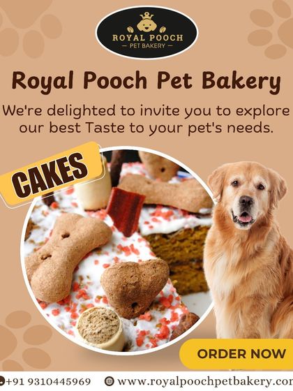 This is a close-up of one of my custom pet cakes, decorated with bone and heart-shaped biscuits. I use wholesome ingredients to create a dense, moist cake that dogs love, ensuring it's a true royal treat for their celebration.