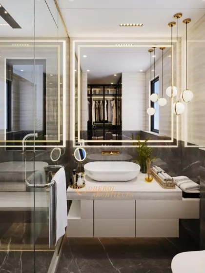 A sophisticated bathroom featuring a dark marble floor, a floating vanity, and a large backlit mirror that reflects the adjacent walk-in closet.