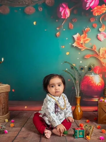 A moment of quiet curiosity in our festive setup. The warm lighting from the candles and diyas adds a magical glow to this beautiful portrait.