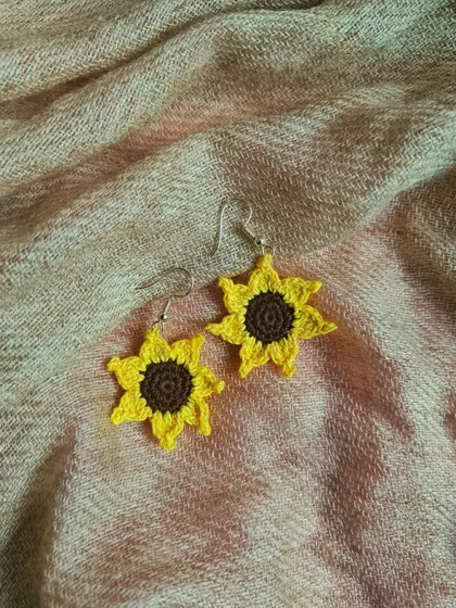 For all the sunflower lovers, we made these cheerful sunflower earrings. Their bright yellow petals and detailed brown center bring a little bit of sunshine to your day.
