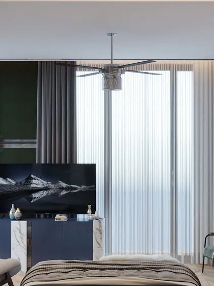 The TV wall in the parents' room is designed with a mix of dark green paneling and marble inlay, creating a sophisticated look. Layered curtains and cozy seating make the room feel peaceful and grounded.