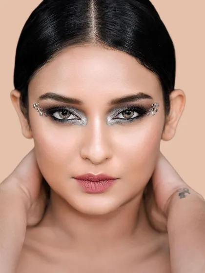A detailed beauty shot focusing on creative makeup and flawless skin. I provide professional retouching to ensure every detail is perfect, making these images ideal for beauty editorials and cosmetic brand campaigns.
