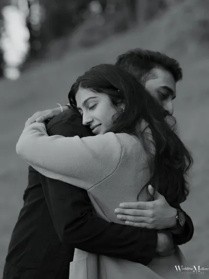 A beautiful black and white portrait of a comforting hug. The image focuses on the emotion and security found in the embrace, creating a timeless and heartfelt photo.