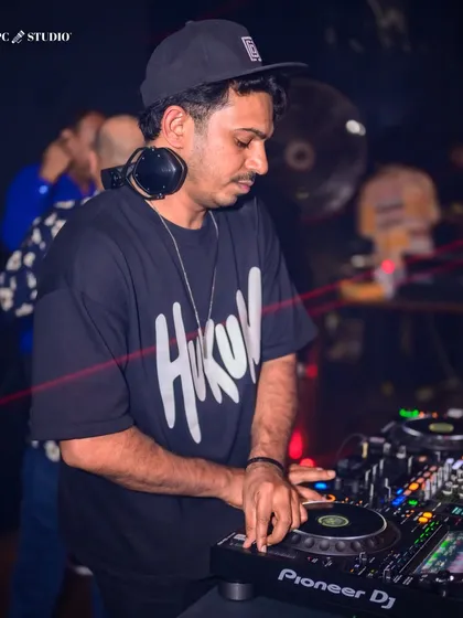 Focused and in the zone. This is a glimpse of me at the Pioneer console, lining up the next track to keep the energy flowing. Every transition is crafted to take the crowd on a journey.