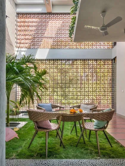 Why limit grass to the outdoors? In this unique courtyard, I installed a wall-to-wall artificial lawn to create an indoor picnic area. It's a surprising and delightful way to make your home feel green.