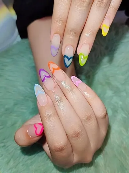Learn to create modern and playful nail art like these colorful heart-shaped French tips. Our curriculum stays up-to-date with the latest trends, so you can offer fresh and popular designs.