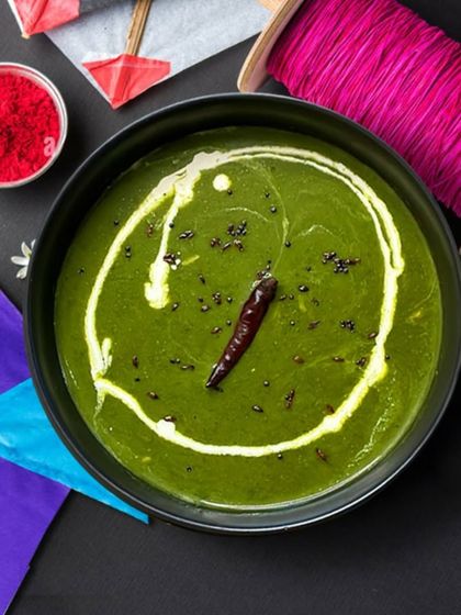 Celebrate the festive spirit with our Haryali Sarson Da Soup, set against a backdrop of kites for Lohri. It's a bowl of warmth and tradition.