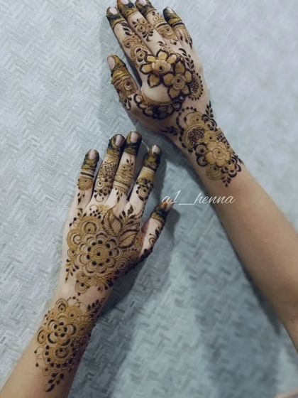 A pair of hands with a matching floral design.