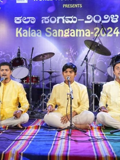 The trio of students performing Annamacharya Keerthanas in unison, a testament to their rigorous group practice.