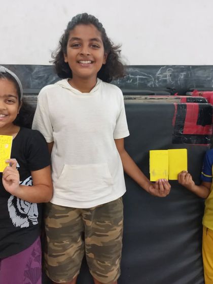 Three happy participants showing off their newly bound books. We love seeing the pride they take in their finished work.