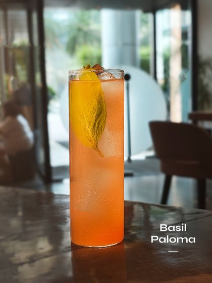 The Basil Paloma, an herbaceous and refreshing take on the tequila classic. The fresh basil adds a green, aromatic note that perfectly complements the grapefruit.