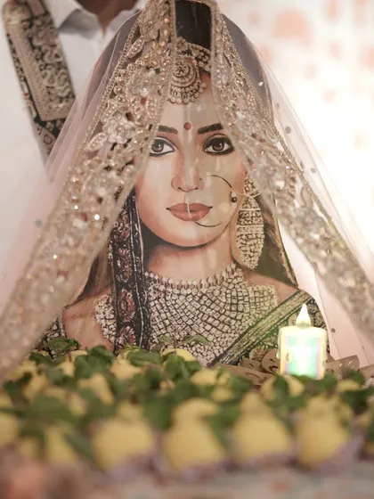 To make a wedding truly personal, I created this hand-painted portrait of the bride as the centerpiece for the dessert display. It's a unique artistic touch that makes the celebration unforgettable.
