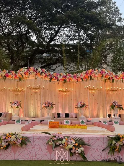 A wider view of the Mamera stage, showcasing the intricate floral work across the top and the soft, romantic lighting that enhances the pink and white color palette.