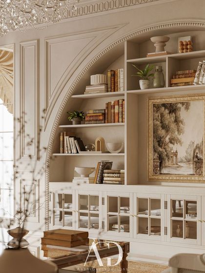 A close-up of the arched built-in shelving, showcasing a curated collection of books and decorative objects. This feature adds visual depth and a sense of personal history to the formal drawing room.