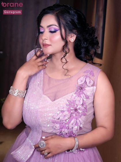 A close up of the lavender look, showing the soft curls and detailed makeup. I teach both hair and makeup to provide a comprehensive skill set.