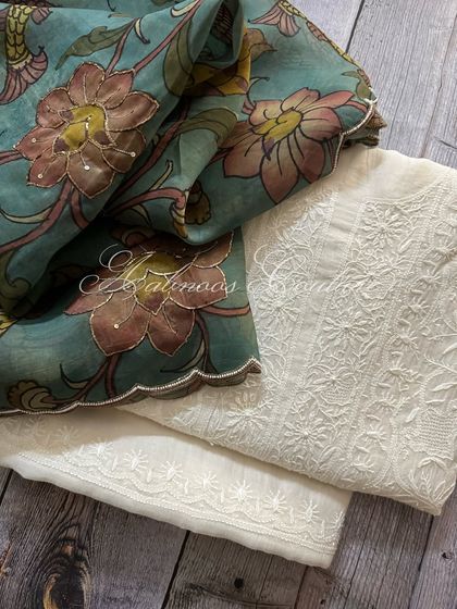 A folded view of the set, showing the Kalamkari dupatta alongside the Chikankari kurta fabric.