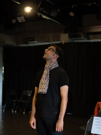 An actor gazes up at the lights during a rehearsal, a moment familiar to every performer who has worked in our space.
