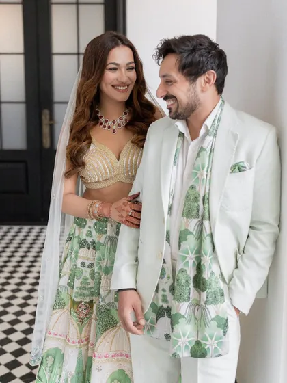 A happy, smiling portrait of the couple, their chemistry evident in their shared glance.