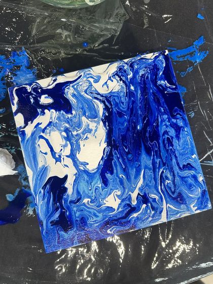 A stunning blue and white fluid art piece from the BMW event. The patterns mimic the flow of water or the sky.