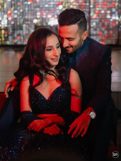 The energy of a Sangeet night in Mumbai is unmatched. We use dramatic lighting and creative angles to capture the glamour and intimacy of your celebrations, creating moody and stylish couple portraits that feel like a scene from a movie.