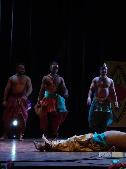 A dramatic scene from a mythological narrative performed on stage. Our productions often explore epic tales, using the expressive vocabulary of Chhau to convey complex emotions and stories.