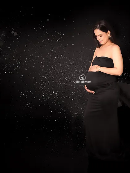 A universe of love within. This portrait uses a starry night background to create a cosmic and magical feel, symbolizing the universe of love a mother holds for her unborn child.