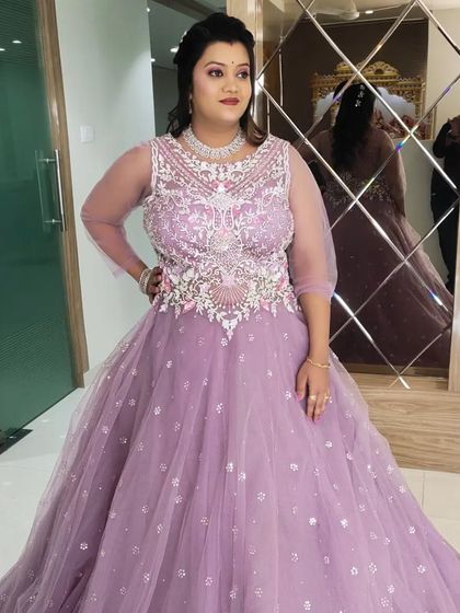 Another angle of the beautiful reception look, showing how the makeup and hair complement the grand dress.