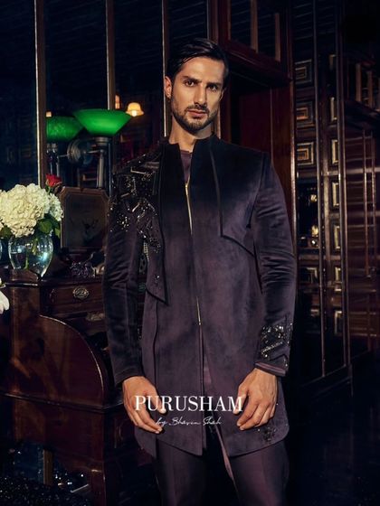 In deep wine and midnight black, these outfits are for men who do not follow a plan, they write one. This asymmetrical velvet jacket is a perfect example.