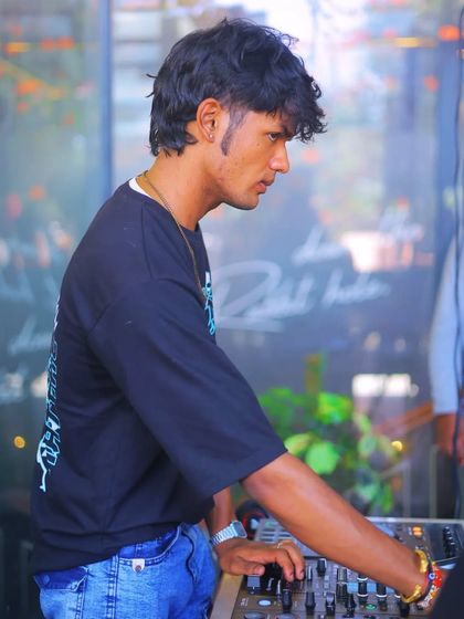 Good vibes and the best beats. A clear, daytime shot of me DJing at an outdoor venue.
