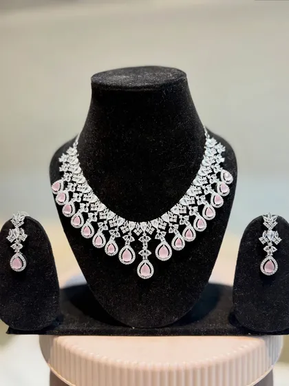 A beautiful silver-plated AD necklace set with pink teardrop stones. This is a very popular design for receptions and parties.