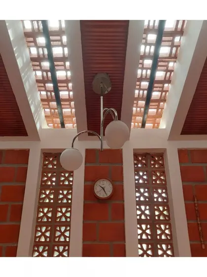 A close-up of the jaali windows and skylight, showing how different openings work together to create a light-filled interior.