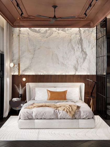 A design concept for a bachelor pad bedroom. The space combines raw and refined materials, with a rough-cut stone feature wall behind the bed, fluted wood paneling, and a dramatic coffered ceiling. Black tinted glass wardrobes add a sleek, modern touch.