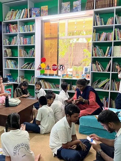 A wide shot of our research assistants working with children in the East Meets West library. This initiative helps us scientifically validate the healing power of stories and continuously improve our approach.