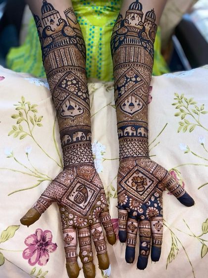 A clear, straight-on shot of the doli-bearer and Ganpati design, showcasing the symmetry and detail.