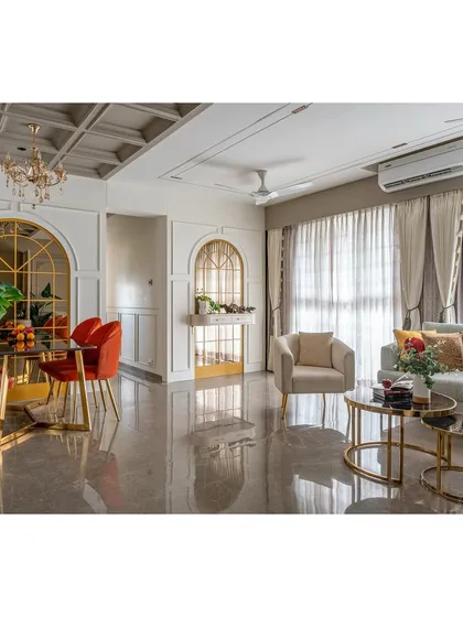 A wide perspective of the living and dining room, showcasing the spaciousness and elegant flow of the design. The sheer curtains allow for natural light while maintaining a sense of privacy.