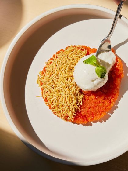 A spoonful of our Sev Boondi, showing the contrast between the warm, sweet base and the cool, creamy ice cream.