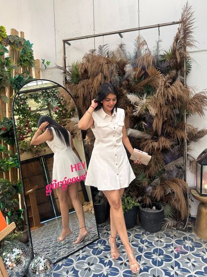 Another full-length shot of the white shirt dress. The A-line silhouette is flattering for many body types, including pear shapes.