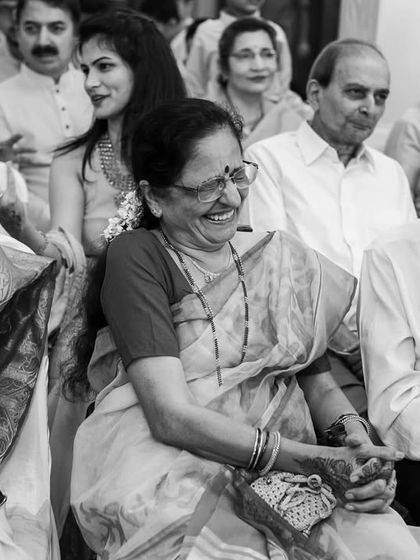 The elder family members enjoying the Sangeet performances, their smiles and laughter adding to the warmth of the occasion.