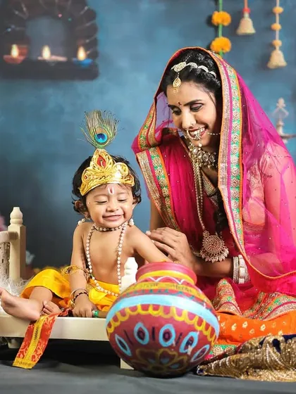 A candid, emotional moment of baby Krishna crying while his mother, Yashoda, lovingly consoles him.