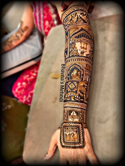 A full-arm design that tells a complete story, with scenes from a wedding procession, including elephants, palanquins, and figures.