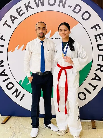 I am incredibly proud to stand with my student after her win at the Indian ITF Taekwon-Do Federation championship. My goal is to prepare athletes for real competition, pushing them to achieve their best.