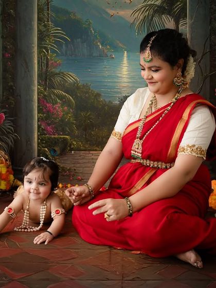 A playful scene where the mother interacts with her crawling baby Krishna against a beautiful lakeside backdrop.