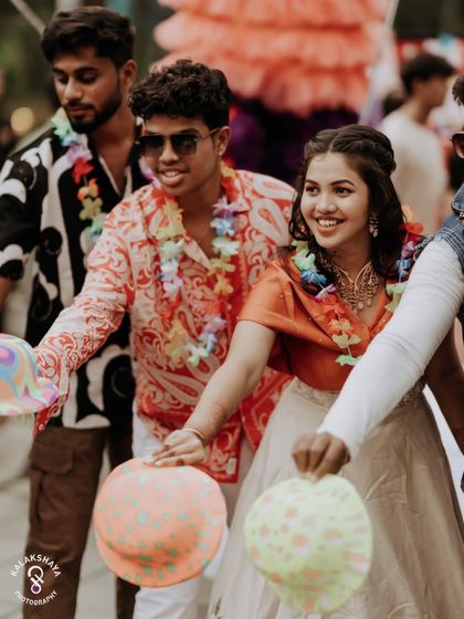 The bride and guests enjoying games with balloons at a fun-filled carnival party.