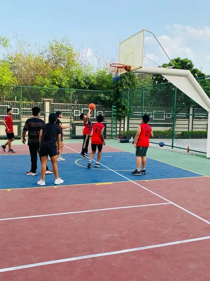 A player attempts a layup in the morning light.