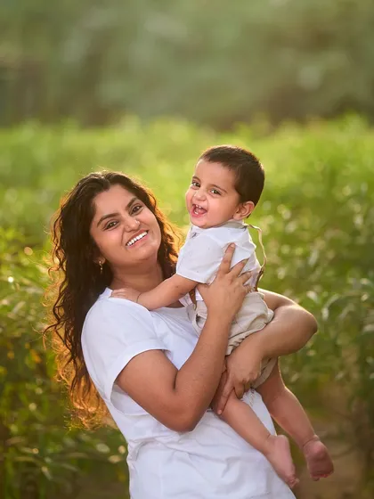 A joyful portrait of a mother holding her laughing baby boy. My focus is always on the connection and smiles that make each family unique.