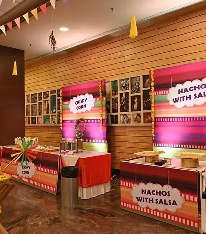 Themed food stalls that match the Haldi decor. Using colorful prints and fun signage for the catering area ensures that every corner of the event feels cohesive and thoughtfully designed.