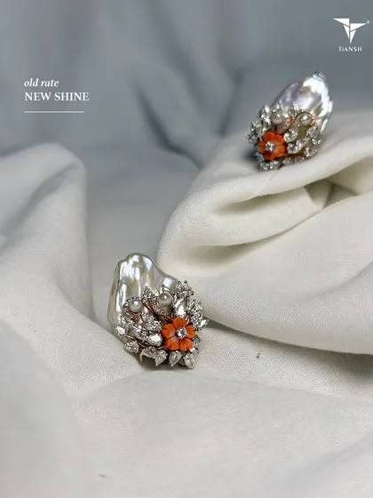 When pearls meet colored stones, it creates magic. These unique rings with carved coral flowers are available now at old gold rates.