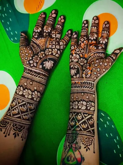 The back of the hands for the same design, showing how the patterns wrap around the arm.