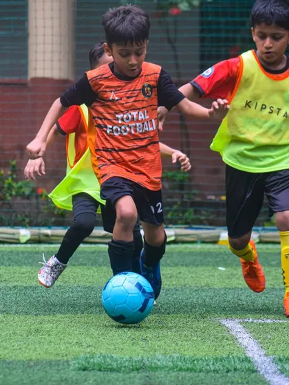 Intense action from the U6 Monsoon Cup, with our player battling for possession.